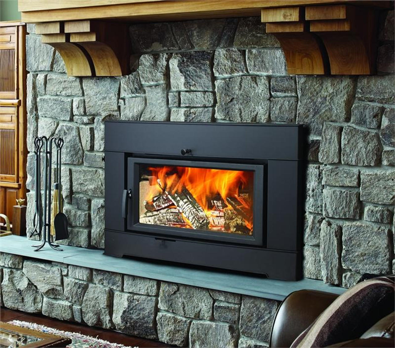 A wood heater fireplace insert radiates warmth in a cozy living room, surrounded by comfortable furniture and soft lighting