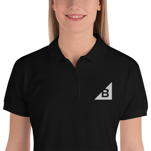 Women's B Mark polo t-shirt front view logo detail, on a small model.