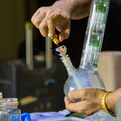 Stylized illustration showing hot smoke entering cool water in a bong