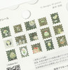 Close-up of the Cafe a la Mode & Post Office flake stickers - green postage-stamp shaped stickers of pudding, parfait, ice cream, cake, teapot and matcha latte