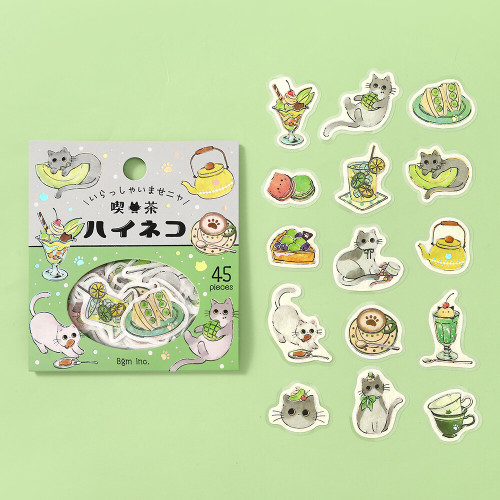 Gray Cat Welcome Meow package with individual die-cut cat and green tea cafe treat stickers on a light green background