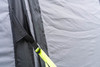 A closeup of the OLPRO Blakedown Breeze 4 Berth Inflatable Tent storm strap that has been tightened.