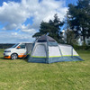 An image of the Hive Breeze® Campervan Awning With Sleeping Pod from OLPRO attached to a Campervan with its door closed.