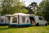 The OLPRO Snug Inflatable campervan Awning attached to the tailgate of a Volkswagen T5 camper, the doors of the awning are open
