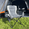 The Henwick Padded Folding Camp Chair - Grey & Charcoal from OLPRO outside of a campervan awning in a campsite.