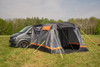 The open front door & fly mesh of a Loopo Breeze® v2 Inflatable Campervan Awning by OLPRO, it is attached to a volkswagen t5 imageset:Charcoal