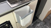 An image of the 9L Folding Camping  Bin Hanging or Free Standing from OLPRO being used in a caravan.