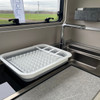 Image of OLPRO Collapsible Dish Drainer, collapsed next to a sink in a campervan, motorhome or caravan.