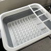 OLPRO Collapsible Dish Drainer, image shows the drainer on a caravan side board.