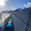 A side view of the protective peak canopy on the OLPRO Cocoon V2 Poled Campervan Awning