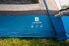 The nameplate on the Cocoon Poled V2 Campervan Awning by OLPRO, it is pitched on a campsite