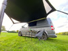 Image of Modern Shade Canopy grey with  Lime by OLPRO fitted on T5 Campervan, picture from low down right side showing the underside and space available under the canopy.