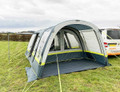 An image of the OLPRO Lime and Grey Cocoon Breeze Campervan Awning Extension attached to the Cocoon Breeze that has been fixed to a VW Campervan.