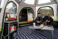 An adult couple inside of the Hive Campervan Awning Fibreglass Poles - with Sleeping Pod from OLPRO.