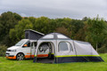 Hive Poled Campervan Awning in a busy campsite attached to a Volkswagen T5