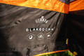 A closeup of the OLPRO Blakedown Breeze 4 Berth Inflatable Tent name and technology logos.
