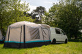 The OLPRO Snug Inflatable campervan Awning attached to the tailgate of a Volkswagen T5 camper, the doors of the awning are shut