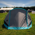view of the Stafford 3.0 OLPRO & Ed Stafford tent with the front door closed, captured from the front at a campsite. 3 berth tent ideal for any camping adventure.