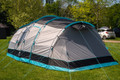 The 6 berth Stafford 6.0 Tent by OLPRO x Ed Stafford on a green campsite