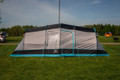 Stafford 6.0 OLPRO x Ed Stafford tent stands on a campsite in it's grey, black & blue colourway