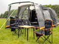 Image of Henwick Padded Folding Camp Chair Orange & Black by OLPRO lifestyle with bamboo compact table.