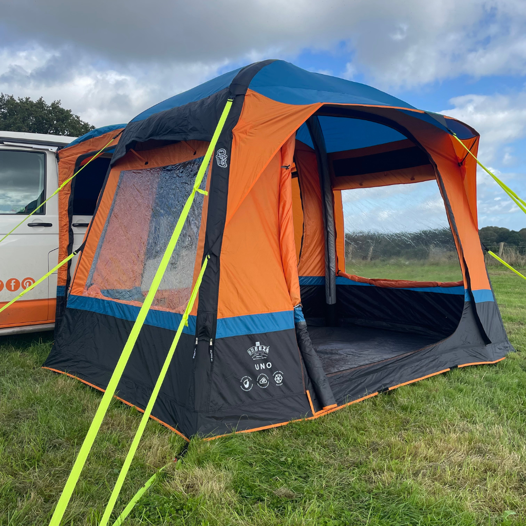 Uno Breeze v2 Campervan Awning - Orange by OLPRO attached to a VolksWagen T5 on a campsite ,imageset:Orange