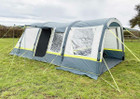 An image of the OLPRO Lime and Grey Cocoon Breeze Campervan Awning Extension attached to the Cocoon Breeze that has been fixed to a VW Campervan.