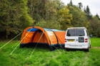 An image of the OLPRO Orange Cocoon Breeze Campervan Awning Extension attached to the Cocoon Breeze that has been fixed to a VW Campervan.