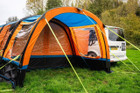 An image of the OLPRO Orange Cocoon Breeze Campervan Awning Extension attached to the Cocoon Breeze that has been fixed to a VW Campervan.