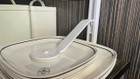 A closeup of the secure a plate from OLPRO being used within a VW Campervan.