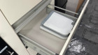 An image of the 9L Folding Camping  Bin Hanging or Free Standing from OLPRO being used in a caravan.