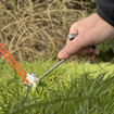 A screw in a hard ground peg from OLPRO is being extracted with the accompanying peg puller.