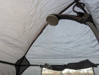 The USB Batter Shower hooked inside an OLPRO Shower Tent.