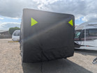 An image of the back of the Breathable Waterproof 4Ply Caravan Cover with Free Hitch Cover Black from OLPRO showing the reflective corners.