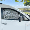 Image of VW Caddy 2003-2020 Internal Thermal Blind Fitted in Side Window on Campsite.