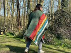 The Original Insulated Blanko® - Cosy Camper Worn as a poncho in a forest.