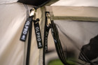 The zips on the front door & front flymesh of the Snug Poled Tailgate Awning