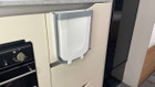 An image of the 9L Folding Camping  Bin Hanging or Free Standing from OLPRO being used in a caravan.