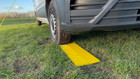 The OLPRO Anti Slip Grip Mat being used in a grassy field with VW Crafter van.