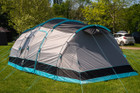 The 6 berth Stafford 6.0 Tent by OLPRO x Ed Stafford on a green campsite
