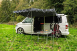 Charcoal Shade Campervan Canopy OLPRO on a camper van, providing cover from the sun