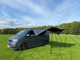 Modern Shade Canopy Grey with Lime by OLPRO Fitted on a T5 Campervan on campsite-
