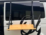 Hanging bamboo table on campervan