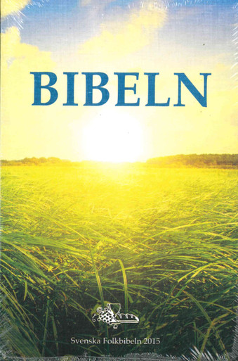 The cover is a picture of a field of tall grass with woods at the far edge of the field and the sun rising over the trees. The cover has the title BIBELN in blue letters near the top.