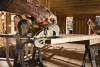 DeWalt 60V FlexVolt circular saw cutting wood on job site.