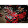 Technician using Milwaukee 48-22-9487 ratchet and socket set with PACKOUT organizer for automotive repair.