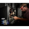 Milwaukee 2104 spot flood headlamp delivering 450 lumens for HVAC and electrical maintenance work.