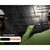 Milwaukee 2010R Rechargeable 250L Penlight using integrated laser pointer for overhead inspection work.