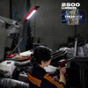 Milwaukee 2129-20 M18 Magnetic Extendable Boom Light illuminating heavy equipment maintenance area.