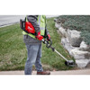 Milwaukee 49-16-2794 M18 FUEL QUIK-LOK Reciprocator Attachment clearing weeds and overgrowth along landscape edging.
